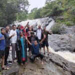 Family enjoying at waterfall near Bowline Nature Stay